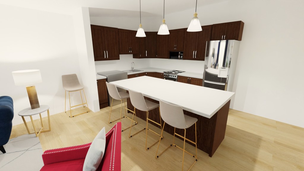 As you walk through the room you return to the kitchen space where an island separates the living room from the kitchen. Barstools with gold legs line the eat at counter. Gold and glass pendant lights hang down tying together the design with the kitchen space which has an older look to it and the original rich wood cabinets.