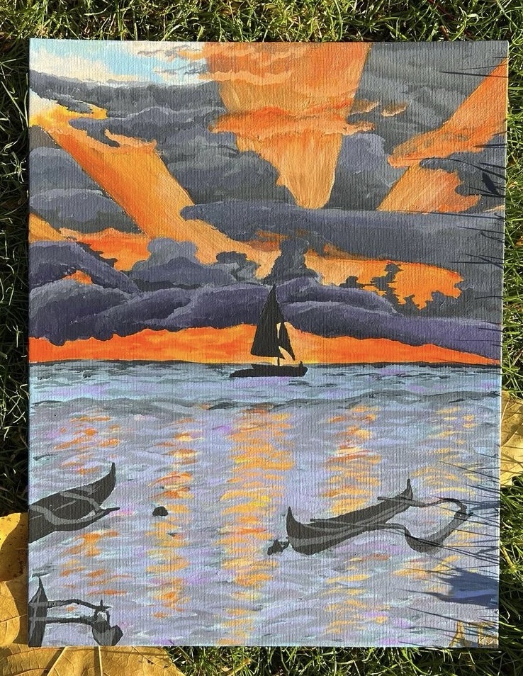 a vivid sunset off the hawaiian coast captures a sailboat in the center with dark grey clouds exploding behind it, pierced by vivid orange and gold rays of sun. The water gently ripples below reflecting the bright colors from above. Two more boats gently rock among the water in the foreground.