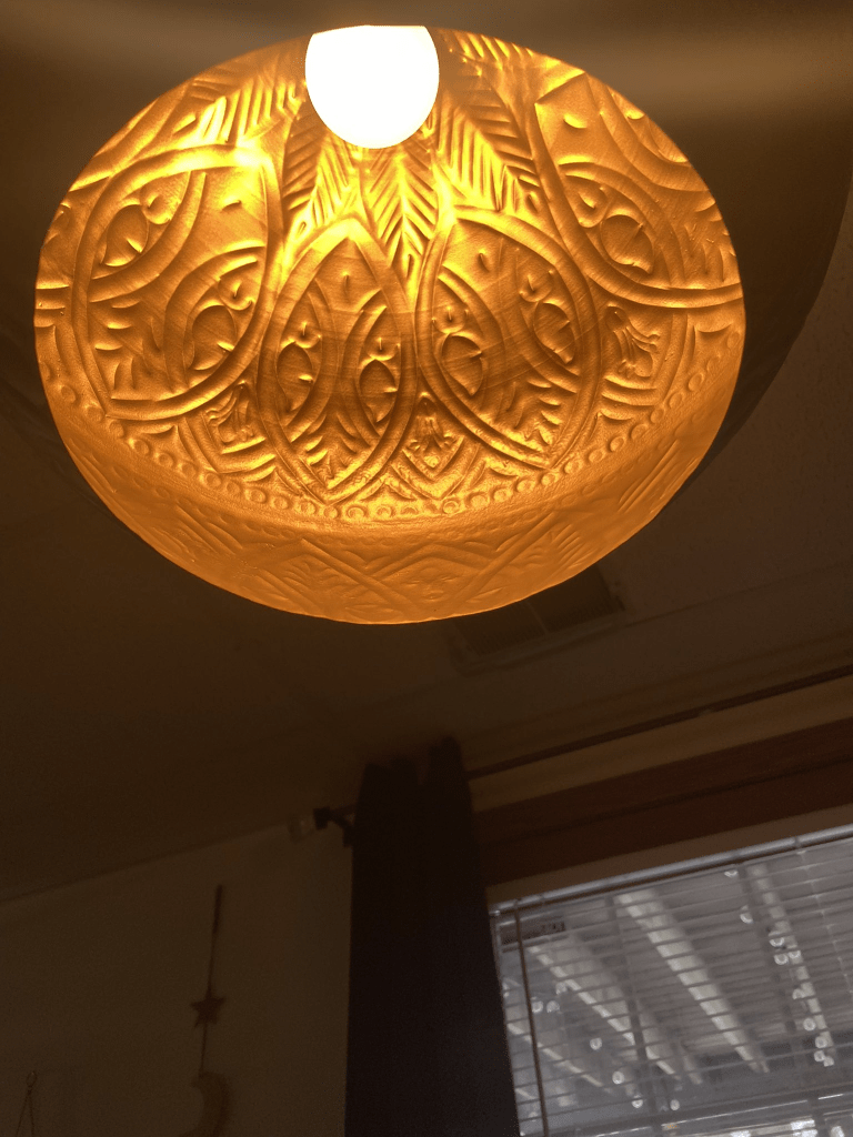 Interior of my island pendants. There are no holes and the lightbulb sits deep into the globe shape reflecting out a soft warm glow.